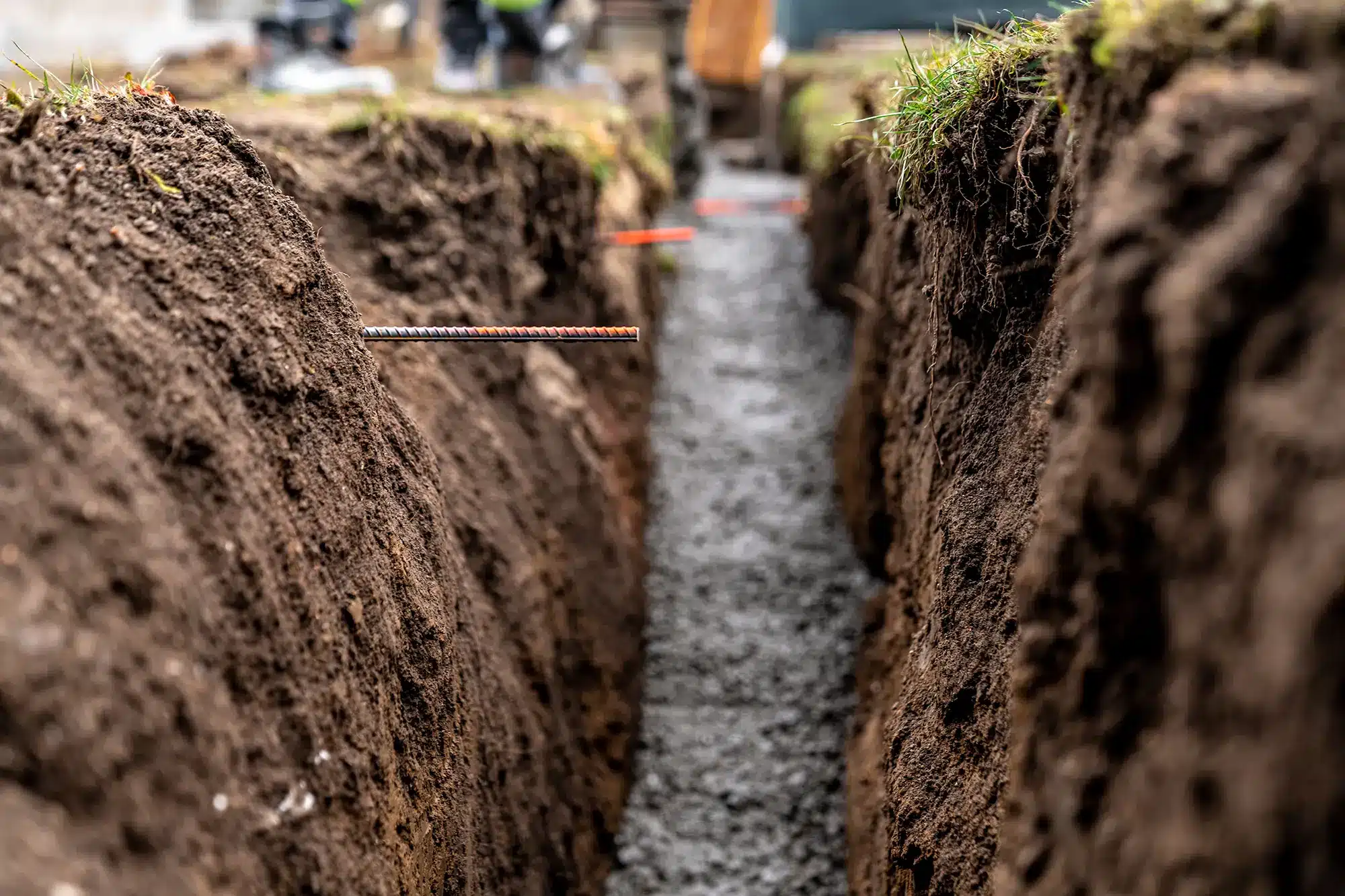 Excavation for sewer line repair beside a family home in the Boise area