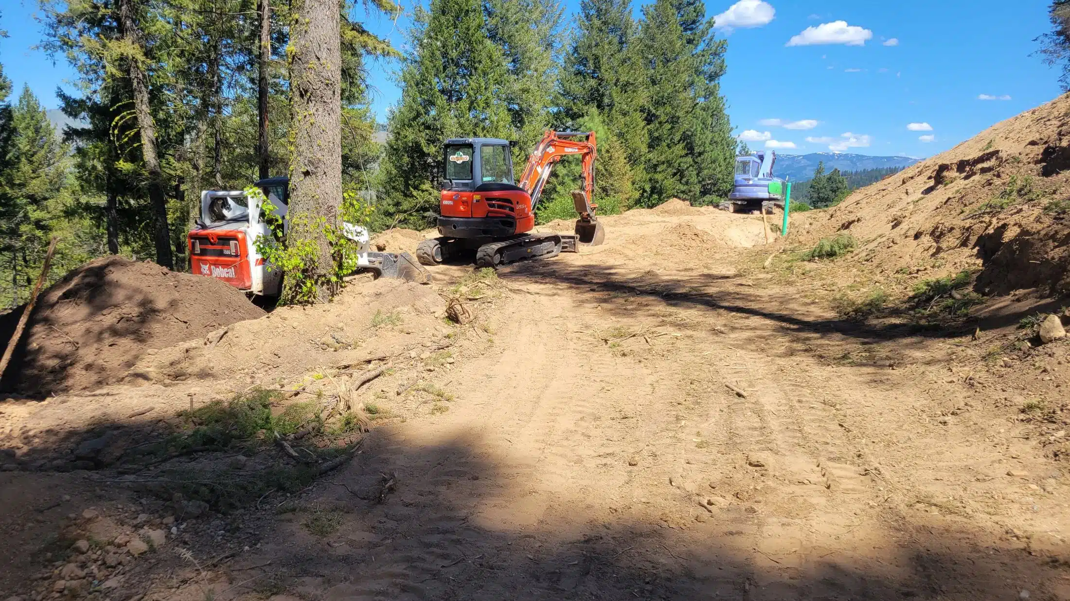 Excavation equipment moving earth during site preparation on former farm ground near Star, Idaho