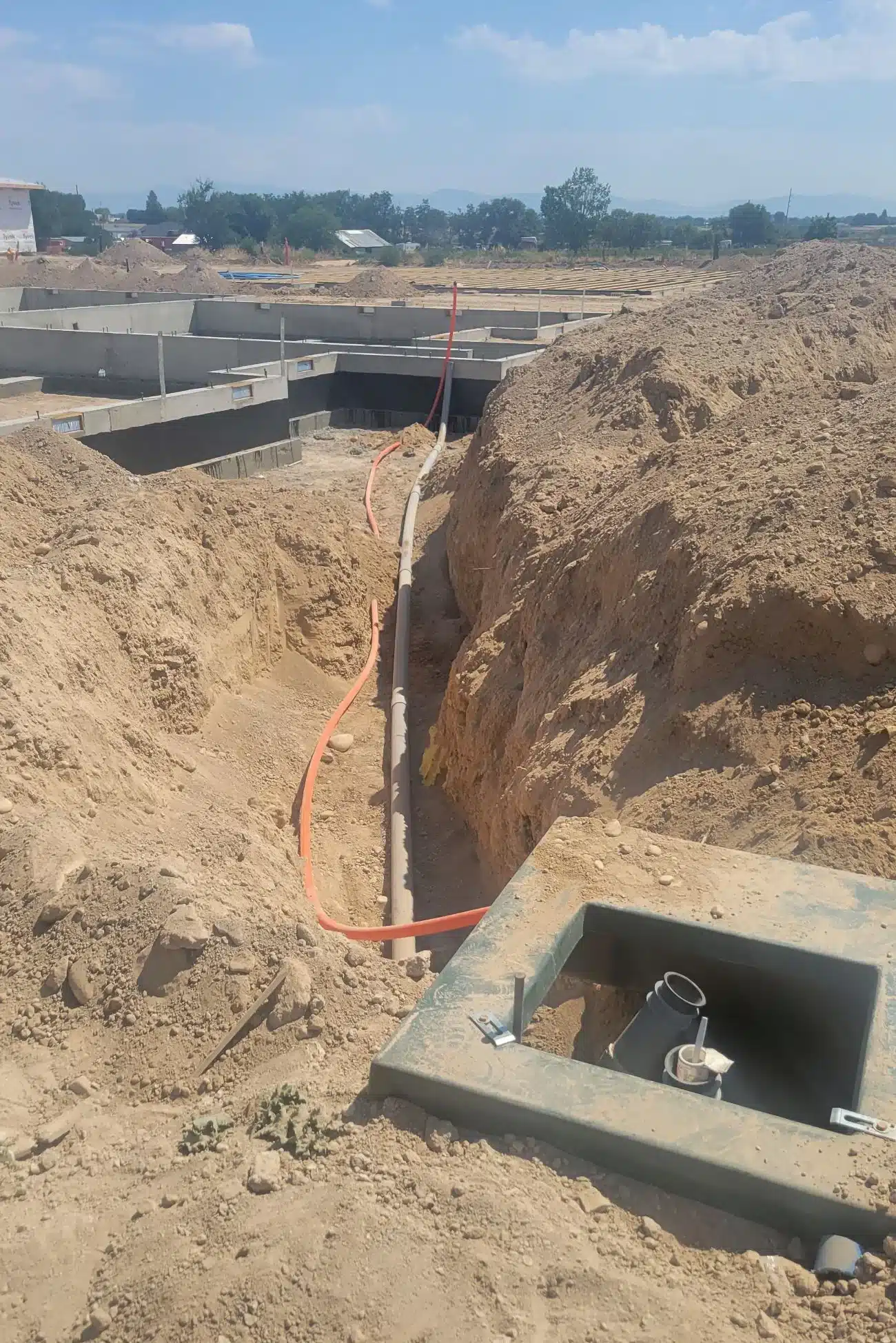 Utility work in a shored trench on a Boise area job site
